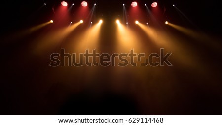 scene, stage light with colored spotlights and smoke Royalty-Free Stock Photo #629114468