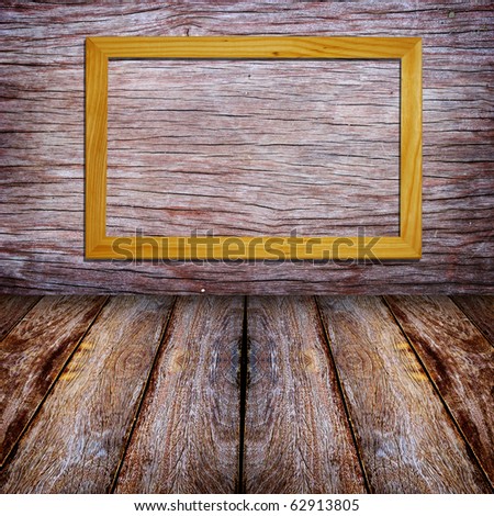 Frame on wood  background and text