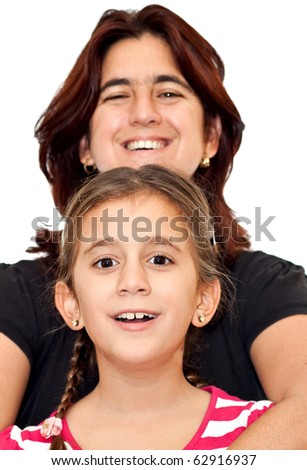 Young latin mother smiling and hugging her small daughter isolated on a white background