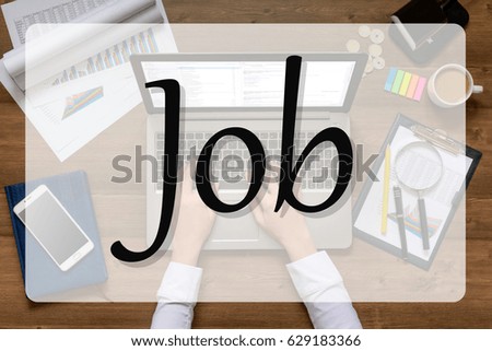 Girl is sitting at table with business accessories, cup of coffee and a laptop, works with drawings, graphs, tables, using smartphone. With text Job