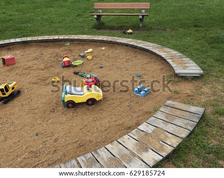 Children's playground with sandbox and toys. Relaxation park, leisure place for families and children. Daily picture without characters.