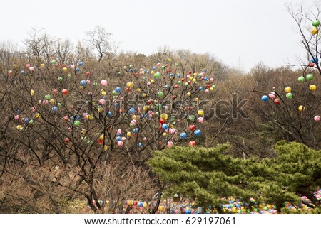 Buddha's birthday paper lanterns hanging over a tree - Gilsangsa(Temple) in seoul Korea
