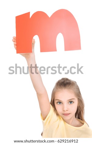 Beautiful girl holding alphabet letter over head isolated, alphabet letters concept