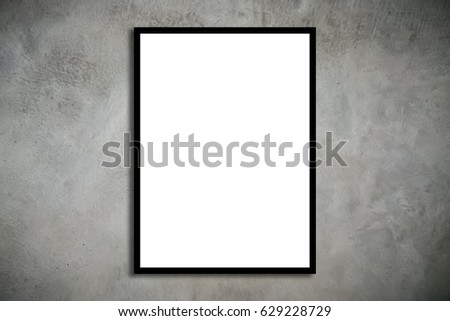 Mock up black wood frame with blank poster hanging on old grungy texture grey concrete wall in loft room style