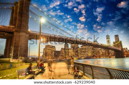 Wonderful view of Brooklyn Bridge and Manhattan skyline at sunset from Brooklyn Bridge Park.