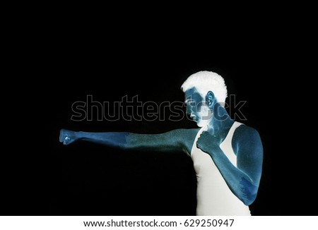 Universe man standing in fighting position with universal power, isolated on black background,