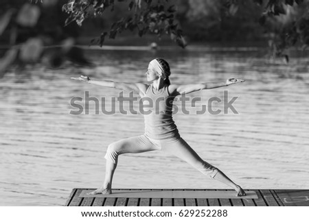yoga girl in the summer park lake