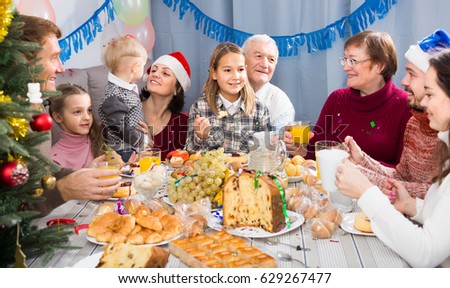 Family members making conversation during Christmas dinner