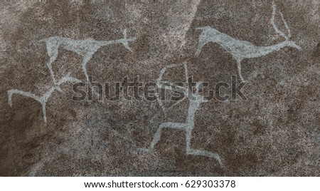 The drawing on the wall of the cave painted by an ancient man. Prehistoric, cave man hunts deer animals. Neanderthal, primitive,. The Stone Age, the ancient world, science.