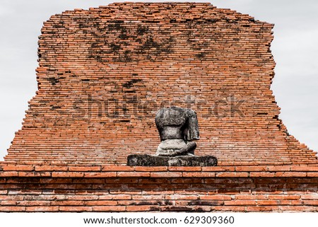 Headless Buddha on brick wall background,Ayutthaya Historical Park, Ayutthaya, Old Town, historic, civilization, history, tourism, World Heritage Site, Thailand,UNESCO.