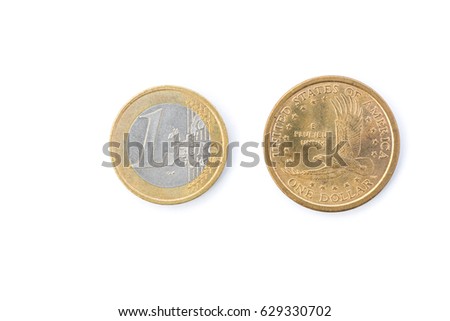 Close-up of One Euro coin and One dollar coin isolated on white background - Shallow DOF.