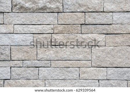 Yellow white sandstone bricks wall background and texture.