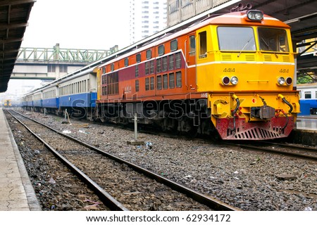 Yellow train engine and rail track Royalty-Free Stock Photo #62934172