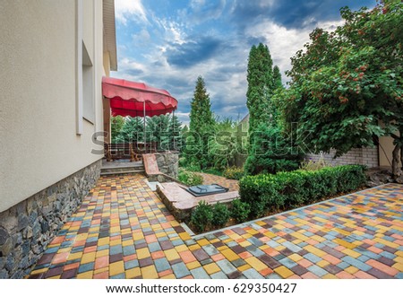 Backyard landscape design with cozy patio area