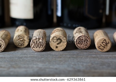 Wine corks with year dates and one with question mark