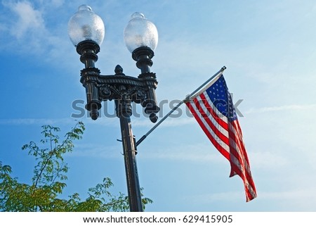 Lamp post with United States flag in Lawton, Michigan