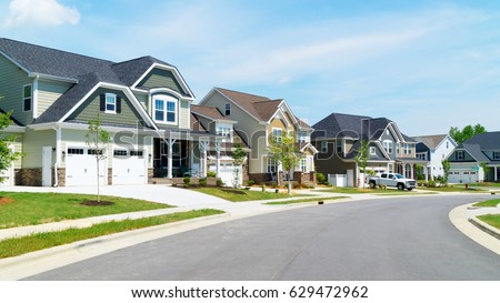 Street of suburban homes Royalty-Free Stock Photo #629472962