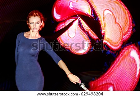 Girl with light emitting diodes, light show
