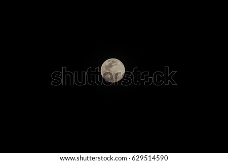 Full moon in the black sky