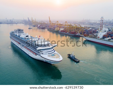 Cruise passenger ship in time of departure to the sea from main entrance channel due of the port, in the morning Sunrise in aerial view