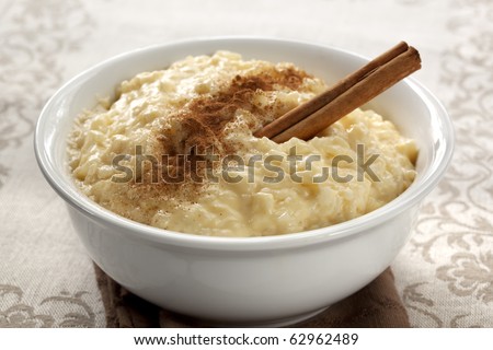 Creamy rice pudding with cinnamon.  A simple, nutritious dessert made from rice, milk, eggs, vanilla and sugar. Royalty-Free Stock Photo #62962489