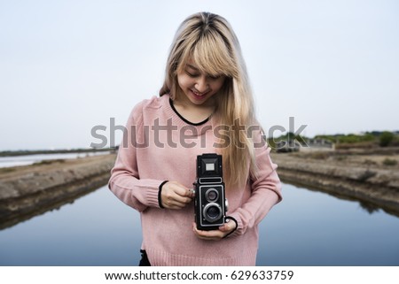 Woman wanderlust with vintage retro camera