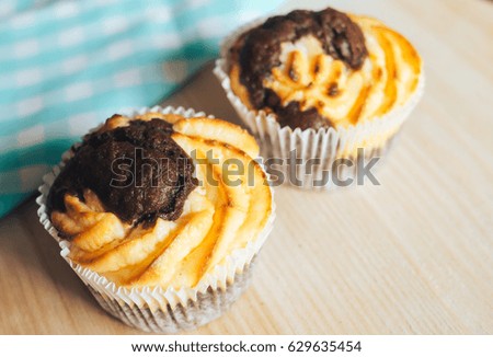 muffins cakes nicely arranged on a wooden background