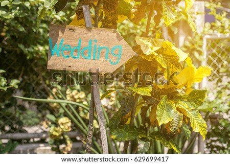 Wooden signboard with the inscription in  paint wedding. Wood hand made wedding decoration