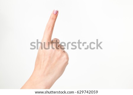 Close up of caucasian adult female caucasian hand isolated on white background. Young woman shows 1 finger while counting. Horizontal color image