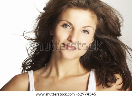 A happy young woman with facial expression on white background