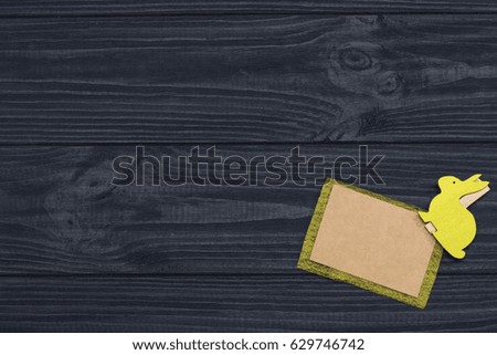 Rabbit on dark wood background for notes