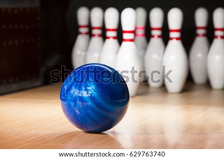 skittles and bowling ball on the playing field