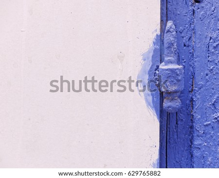 blue white background, grunge door hinge detail