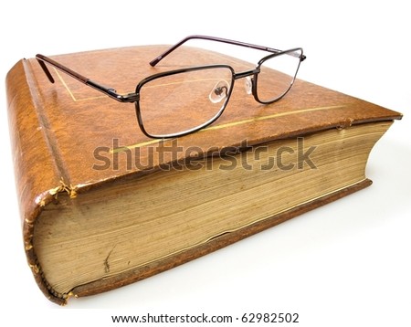 Eyeglass with the old book