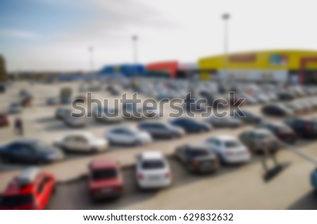 Blurred Car parking in a supermarket complex in the evening