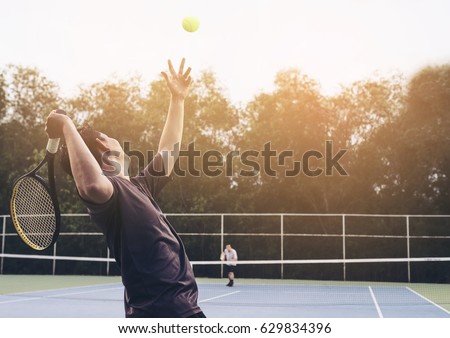 Tennis match which a serving player Royalty-Free Stock Photo #629834396