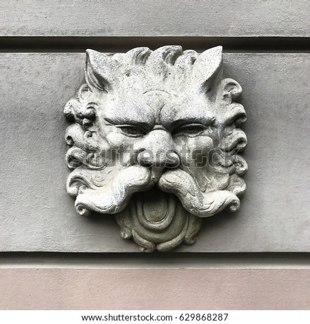 Lion head on the wall monument