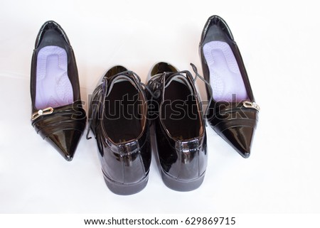 In the picture are man's shoes and the women's shoes.