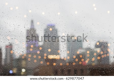 Rainy Skyline Behind Window