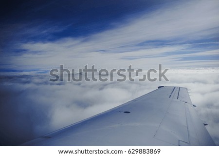 wing aircraft in cloudy weather, the evening cool colors