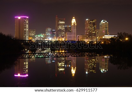 Skyline of Columbus, OH at night. Taken from across the Scioto River, with reflection in water
