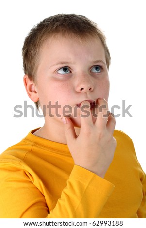 10 year old boy tasting his own finger isolated on white