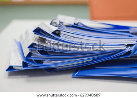 close up - file folder with documents and documents. retention of contracts on table in meeting room 