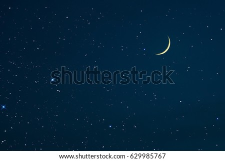 the new rising moon in the night sky and stars  Royalty-Free Stock Photo #629985767
