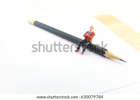 Miniature business man with blank document paper 