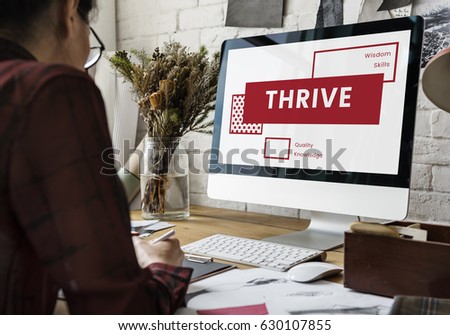 Graphic Designer Working and Using Computer on the Wooden Table