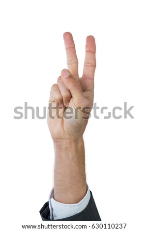 Hand of businessman gesturing against white background