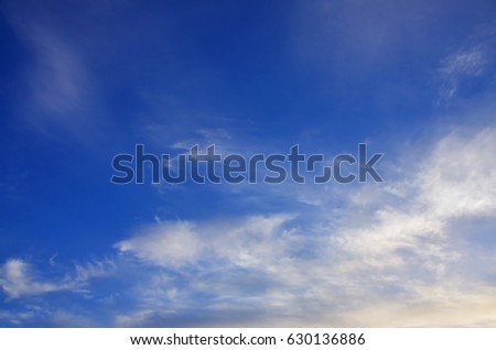 Heavenly space of blue color with a lot of thick white clouds. Background picture of a cloudy sky showing favorable weather