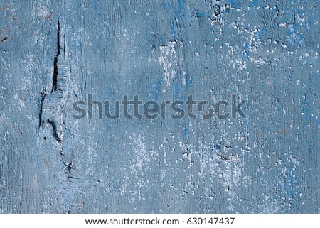 Closeup picture of an old wooden boat painted in blue. Texture of an old aged blue paint on  wooden textured surface