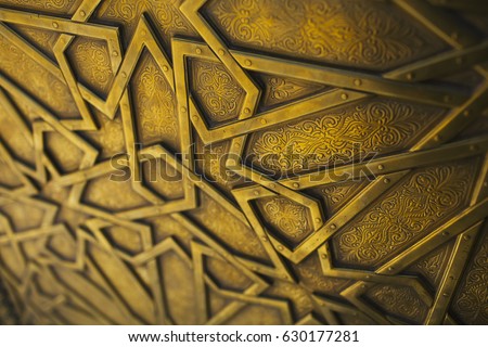 Detail of the artisan door of the royal palace in Fez, Morocco. Royalty-Free Stock Photo #630177281